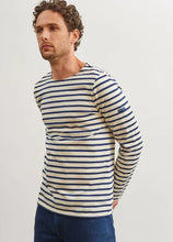 Load image into Gallery viewer, Model wearing Saint James - Minquiers Modern Men's Striped Sailor Shirt in Ecru/Marine.