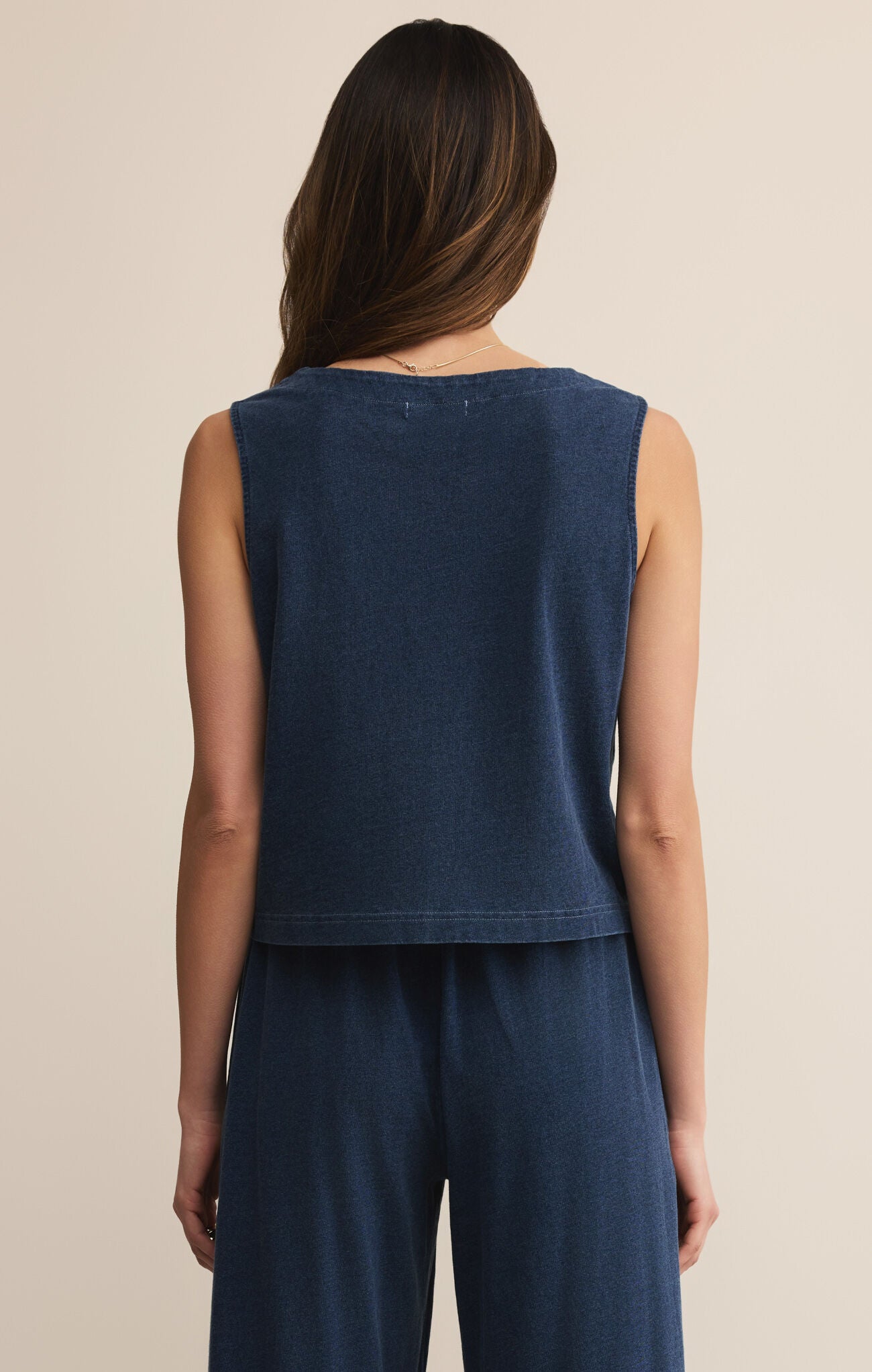 Model wearing ZSupply Solace Jersey Denim Top Indigo - back.