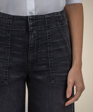 Load image into Gallery viewer, Model wearing Kut From The Kloth - Meg High Rise Wide Leg Raw Hem KG1864MA2 in Specialist w/Black Base Wash.
