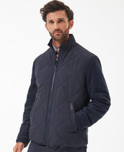 Load image into Gallery viewer, Model wearing Barbour Hybrid Fleece Jacket in Navy.