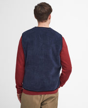 Load image into Gallery viewer, Model wearing Barbour Liddesdale Fleece Vest in Navy - back.