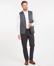 Load image into Gallery viewer, Model wearing Barbour Polarquilt Waistcoat Zip-In Liner in Navy.