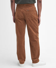 Load image into Gallery viewer, Model wearing Barbour Stretch Cord Trouser in Dark Honey - back.