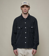 Load image into Gallery viewer, Model wearing Merz B. Schwanen - Good Basics Corduroy Overshirt in Deep Black.