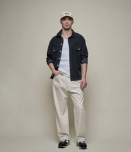Load image into Gallery viewer, Model wearing Merz B. Schwanen - Good Basics Corduroy Overshirt in Deep Black.