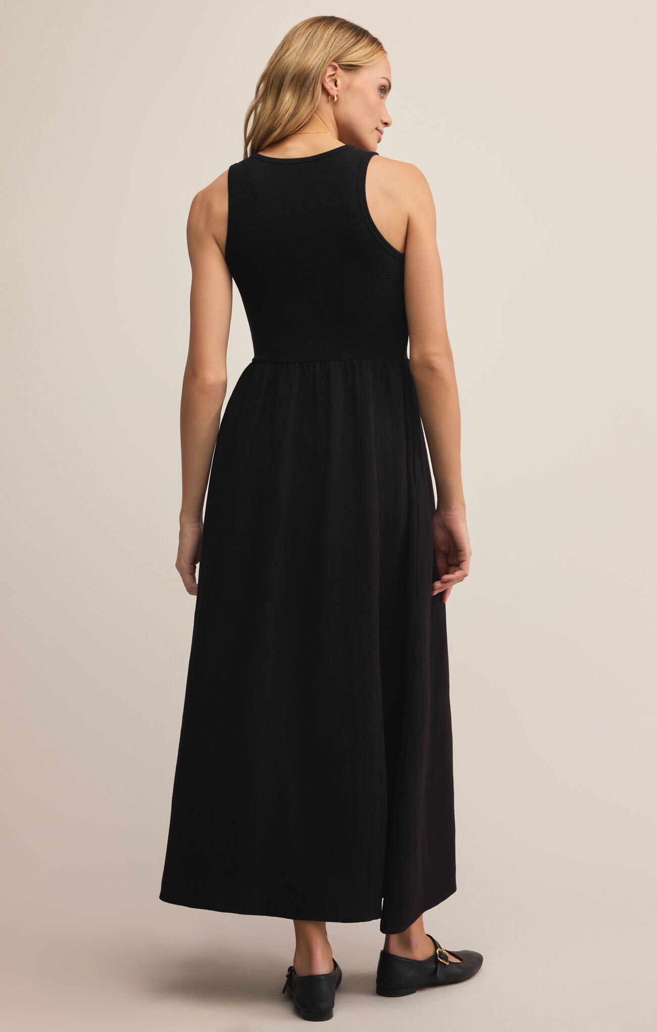 Model wearing ZSupply Charlotte Midi Dress in Black - back.