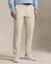 Load image into Gallery viewer, Model wearing RLX - Ralph Lauren Performance Pant in Sand.