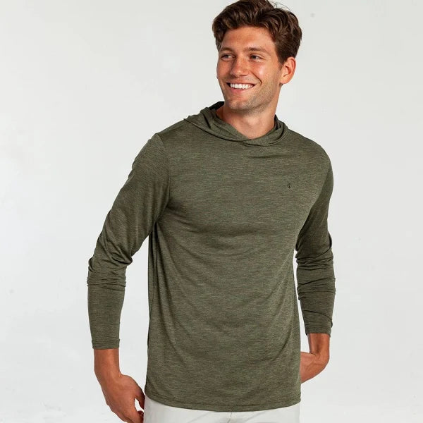 Model wearing Criquet - LS Performance Sport Hoodie in Cloverfield.