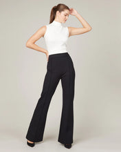 Load image into Gallery viewer, Model wearing Spanx - The Perfect Pant, Hi-Rise Flare in Classic Black 20252R.