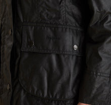 Load image into Gallery viewer, Model wearing Barbour Beadnell wax jacket in black.