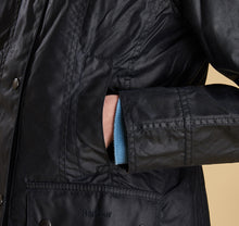 Load image into Gallery viewer, Model wearing Barbour Beadnell wax jacket in navy.