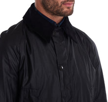 Load image into Gallery viewer, Model wearing a Barbour Ashby waxed jacket in black.