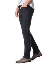 Load image into Gallery viewer, Model wearing Rodd & Gunn Motion 2 Straight Jean RL Navy.