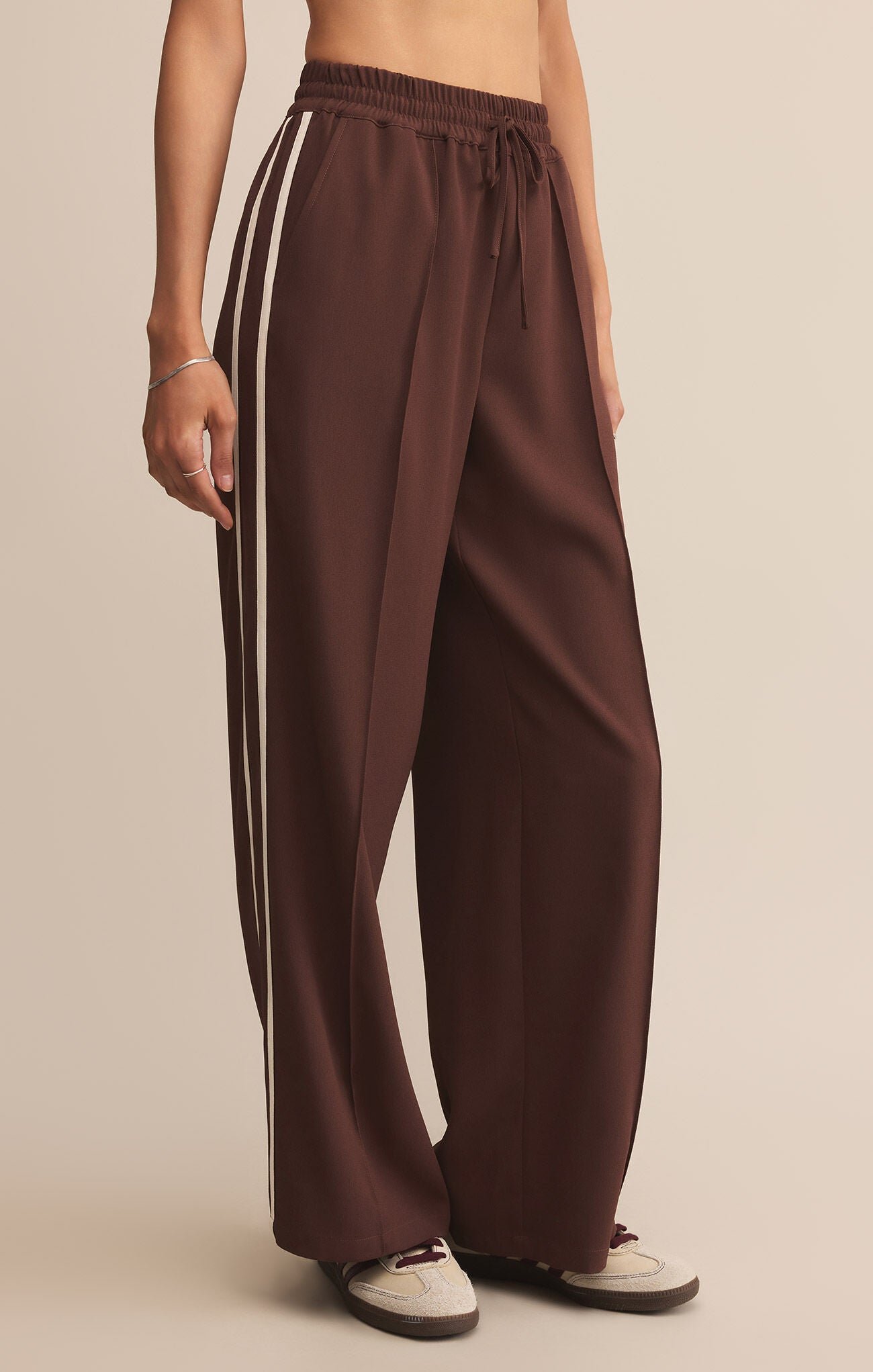 Model wearing ZSupply Saunder Track Pant in Sandalwood.