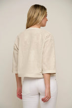 Load image into Gallery viewer, Model wearing Rino &amp; Pelle - Babette Perf Cropped Jacket in Birch - back.
