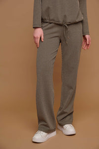 Model wearing Rino & Pelle - Bindina Wide Leg Trousers in Stone Graphics.