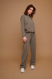 Model wearing Rino & Pelle - Bindina Wide Leg Trousers in Stone Graphics.