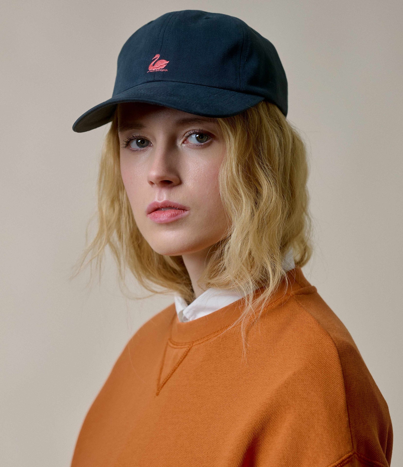 Model wearing Merz B. Schwanen - Good Basics Swan Logo Cap in Charcoal