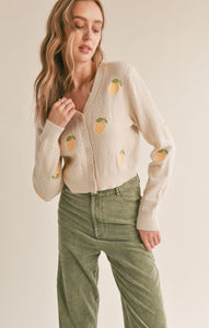 Model wearing Sadie & Sage - Esme Embroidered Lemon Cardigan in Cream Lemon.