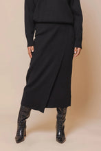 Load image into Gallery viewer, Model wearing Rino &amp; Pelle - Janou Midi Skirt in Black.
