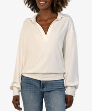 Load image into Gallery viewer, Model wearing Kut from the Kloth - Audrina LS Half Placket Knit Top in Ivory.
