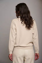 Load image into Gallery viewer, Model wearing Rino &amp; Pelle - Kassi Sweater in Blanc - back.
