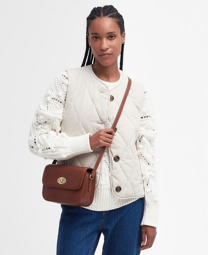 Model wearing Barbour Isla Crossbody Bag in Brown.