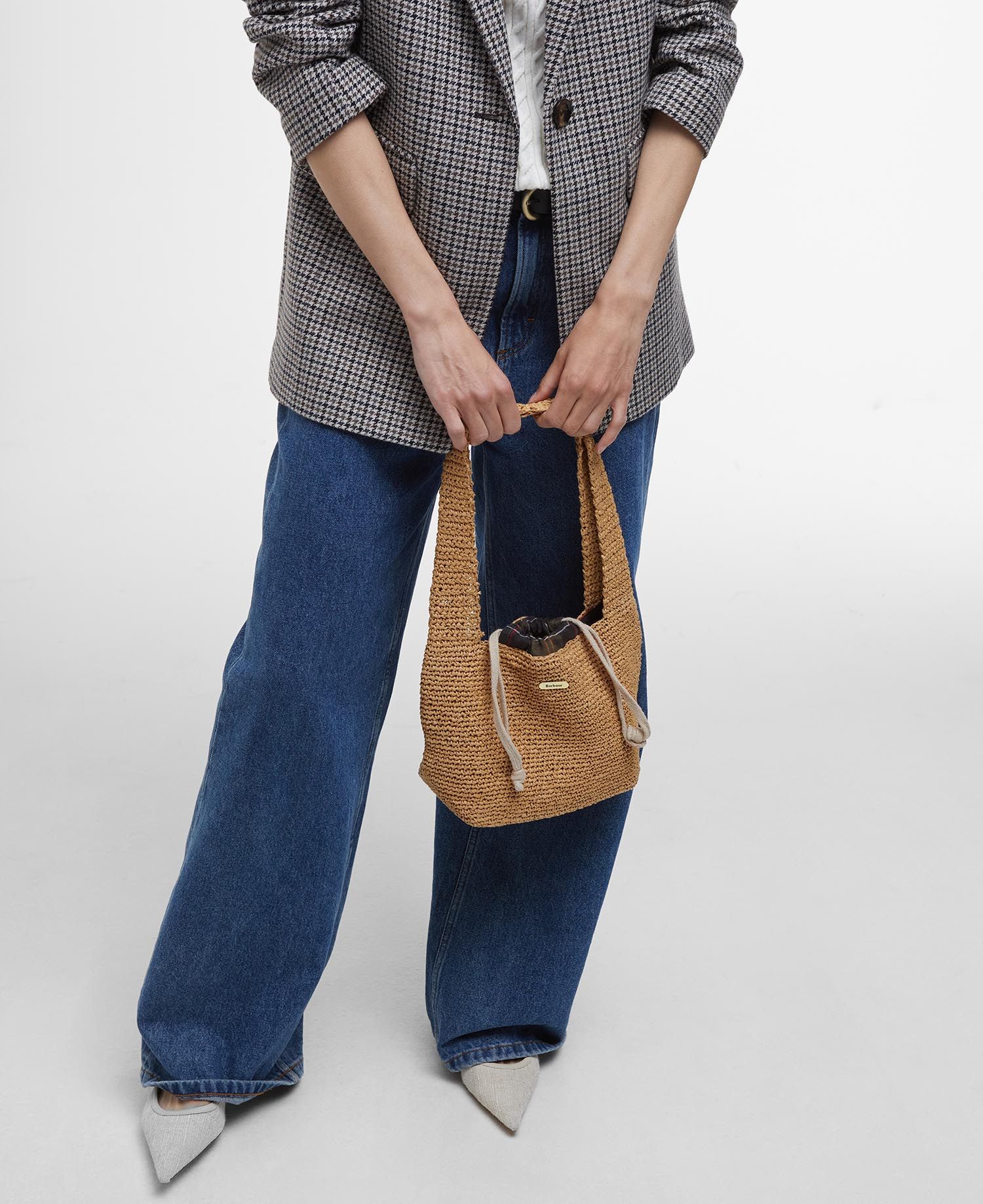 Model holding Barbour Lily Soft Tote Bag in Natural.