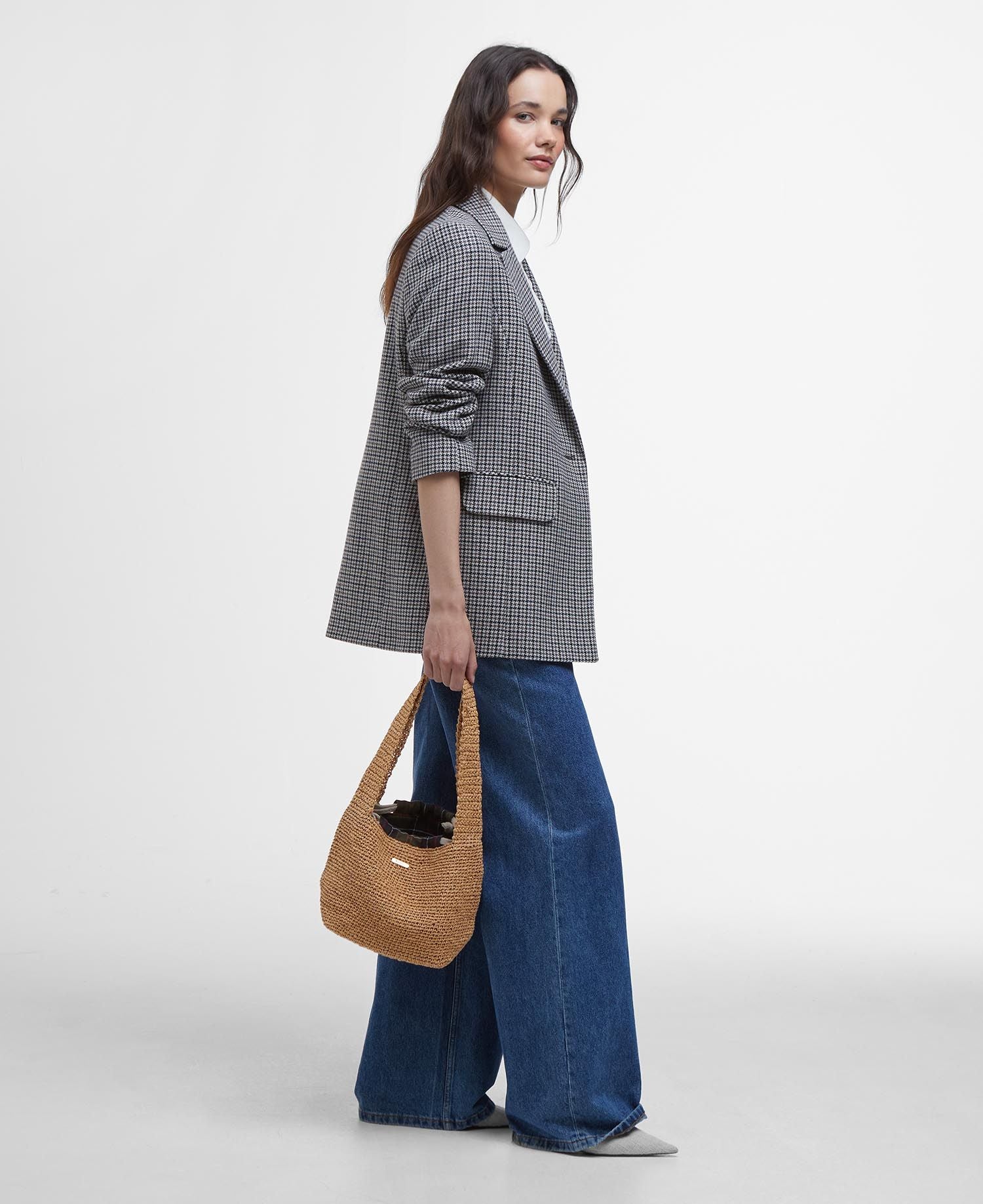 Model holding Barbour Lily Soft Tote Bag in Natural.