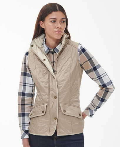Model wearing Barbour Cavalry Gilet in Light Fawn.