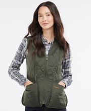 Load image into Gallery viewer, Model wearing Barbour Fleece Betty Liner in Dark Olive.
