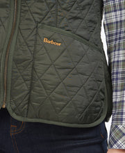 Load image into Gallery viewer, Model wearing Barbour Fleece Betty Liner in Dark Olive.
