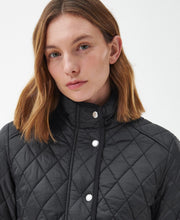 Load image into Gallery viewer, Model wearing Barbour Yarrow Quilt in Black/Rose Garden Floral.
