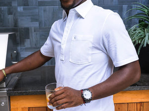 Model wearing  Criquet - Top-Shelf Players Polo in White.