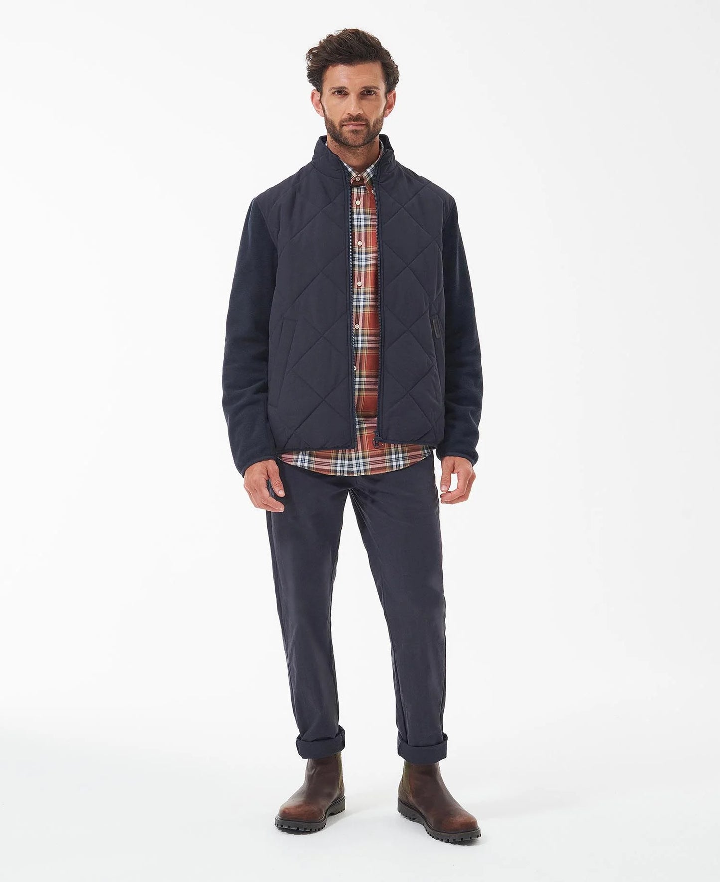 Model wearing Barbour Hybrid Fleece Jacket in Navy.