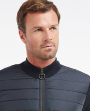 Load image into Gallery viewer, Model wearing Barbour Essential Carn Baffle Zip Thru in Navy.
