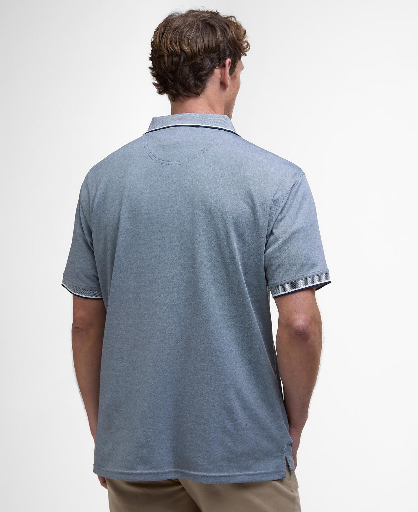 Model wearing Barbour Heydon Performance Polo Shirt in Navy - back.