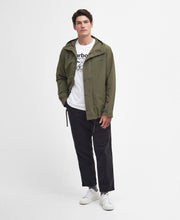 Load image into Gallery viewer, Model wearing Barbour Quay Showerproof Jacket in Olive.
