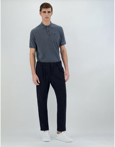 Model wearing Herno - Men's Trousers in Light Non-washed Scuba in Blue Navy.