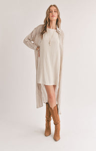 Model wearing Sadie & Sage - Sands Thinstripe Outer Layer Duster Shirt in Ivory/Taupe.