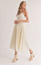 Load image into Gallery viewer, Model wearing Sadie &amp; Sage - Shades on Front Cutout Midi Dress in Ivory.
