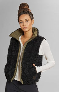 Model wearing Alp N Rock - Sonja Reversible Short Vest in Dark Moss.