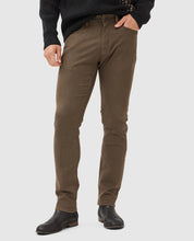 Load image into Gallery viewer, Model wearing Rodd &amp; Gunn - Motion Melange Straight Fit Jean in Nutmeg.
