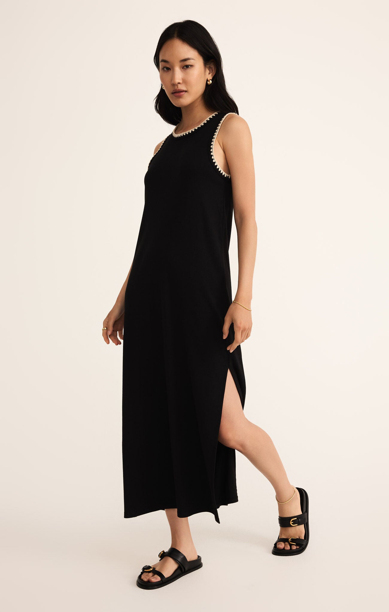 Model wearing ZSupply Delamer Midi Dress in Black.