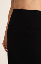 Load image into Gallery viewer, Model wearing ZSupply - Gail Midi Skirt in True Black.
