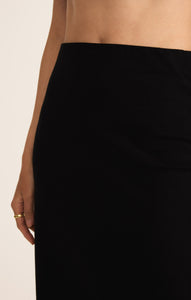 Model wearing ZSupply - Gail Midi Skirt in True Black.