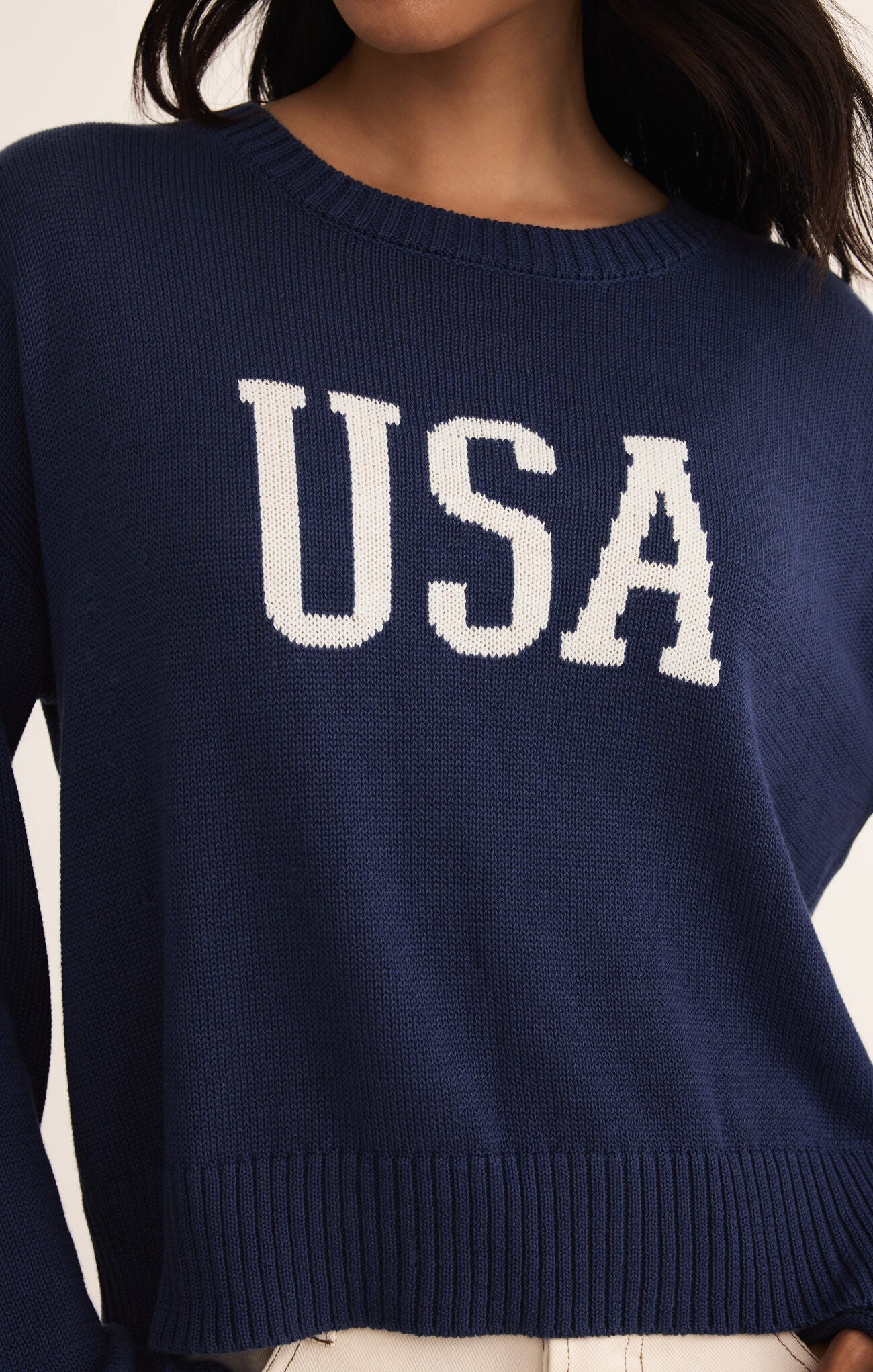 Model wearing ZSupply - Sienna USA Sweater in Yacht Blue.