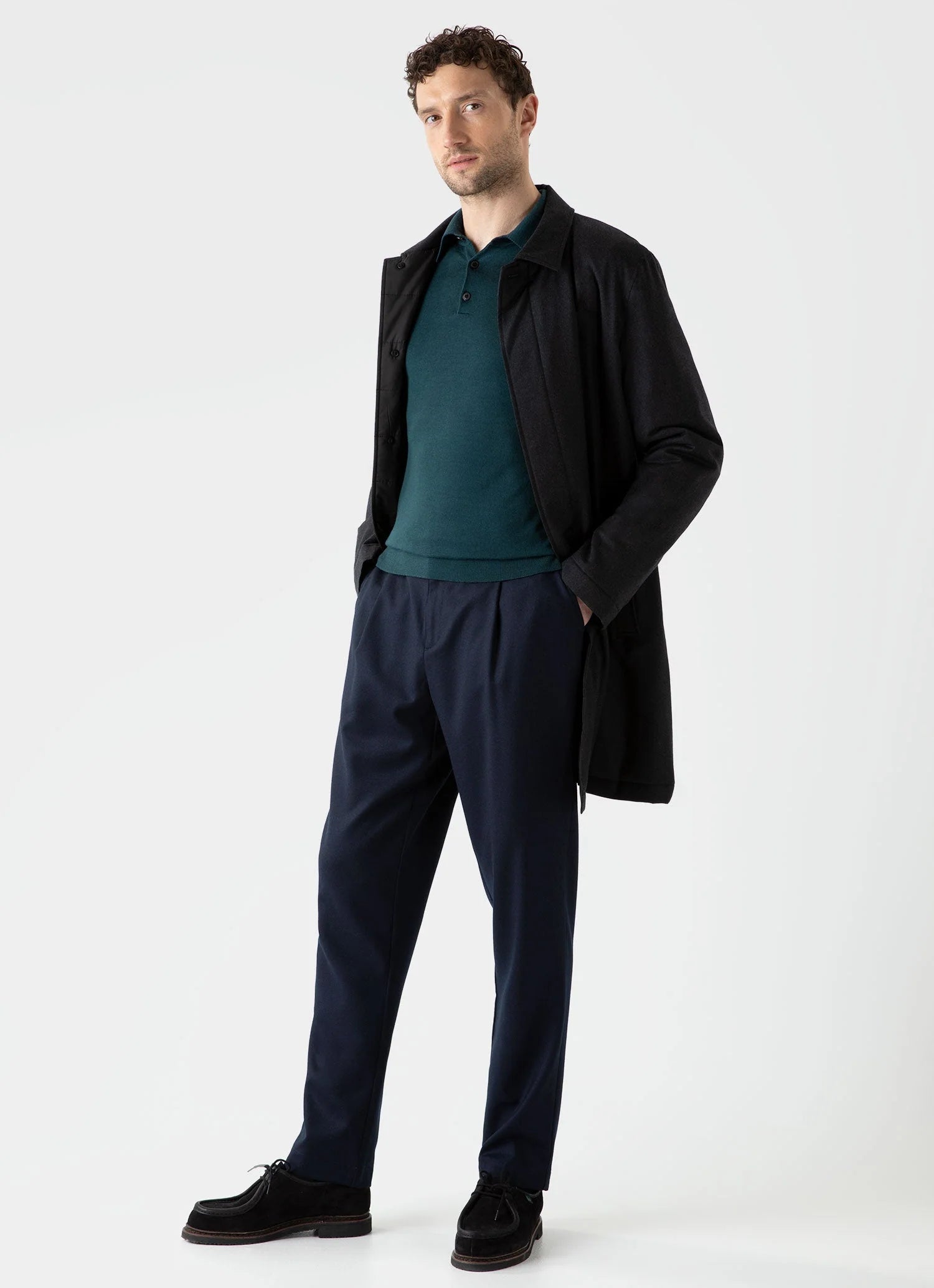 Model wearing Sunspel - Fine Merino Wool LS Polo Shirt in Peacock.