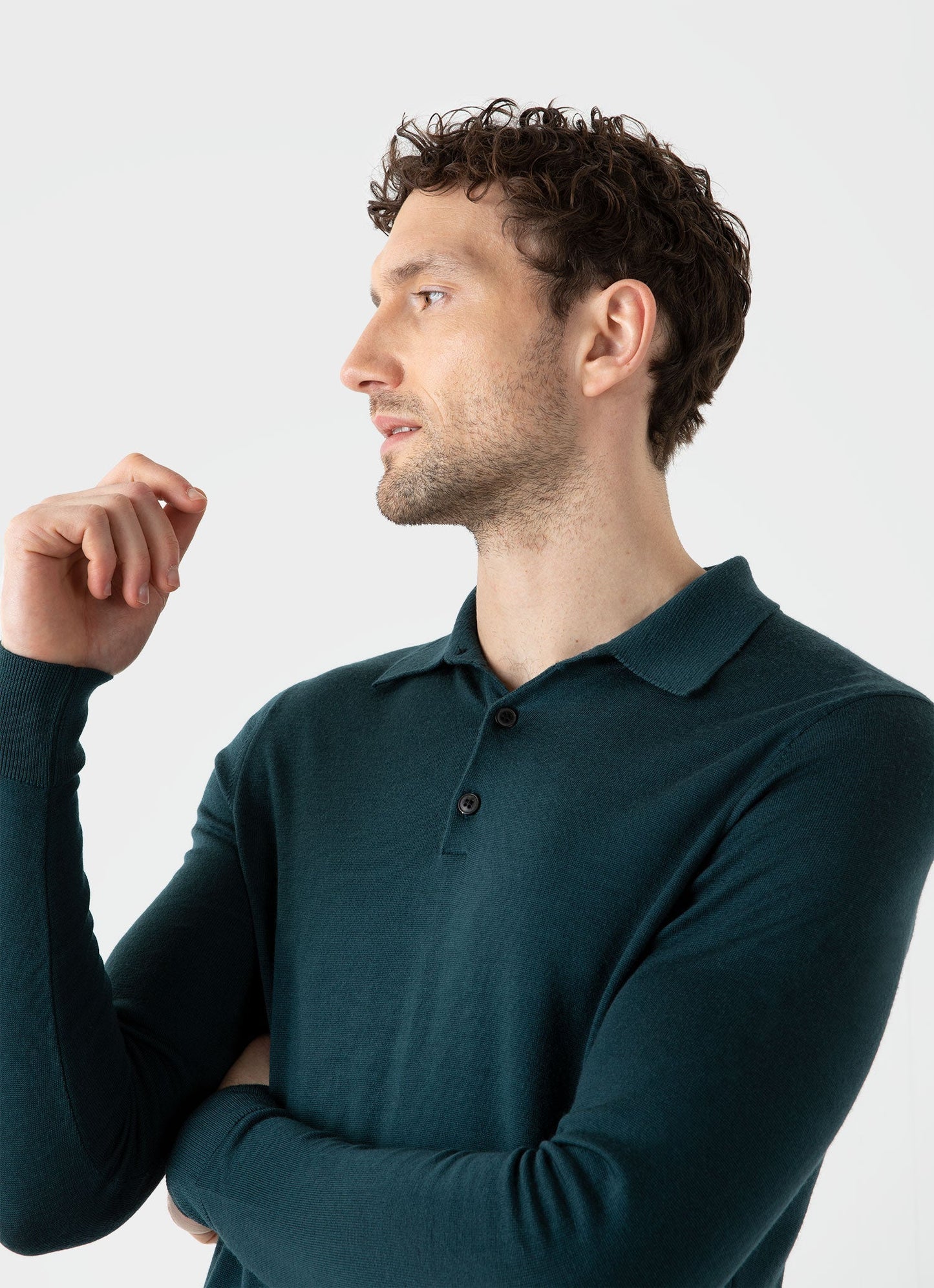 Model wearing Sunspel - Fine Merino Wool LS Polo Shirt in Peacock.