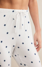 Load image into Gallery viewer, Model wearing ZSupply - Classic Mini Stars Jogger in White/Navy.
